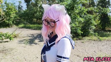 Sexy schoolgirl with ears in uniform walks down the abandoned road